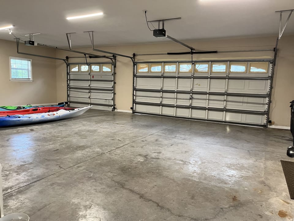three car garage with 4 kayaks, only two spots available to park