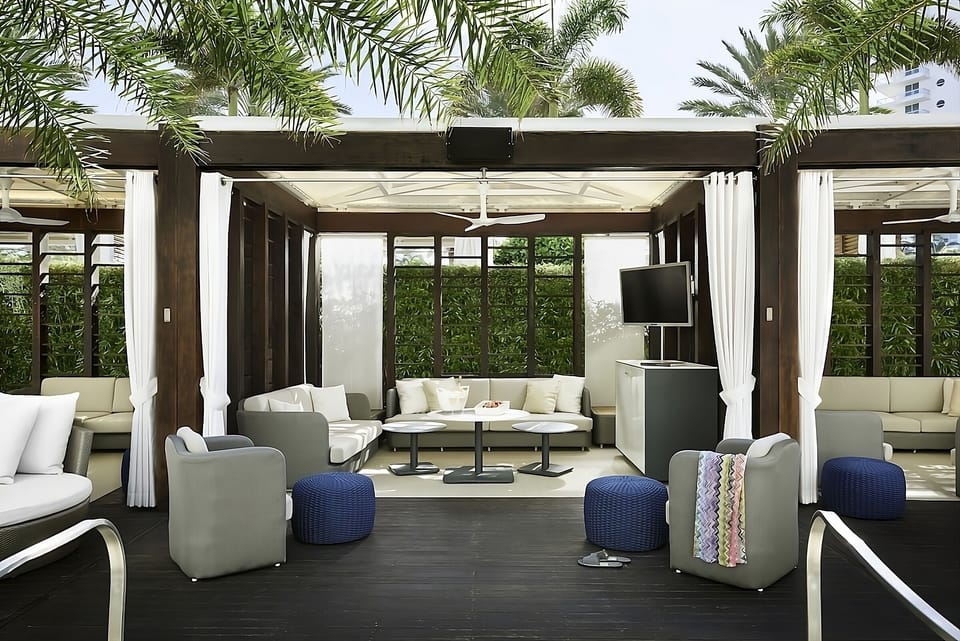 Lounge in a shaded cabana with breezy, resort comfort.