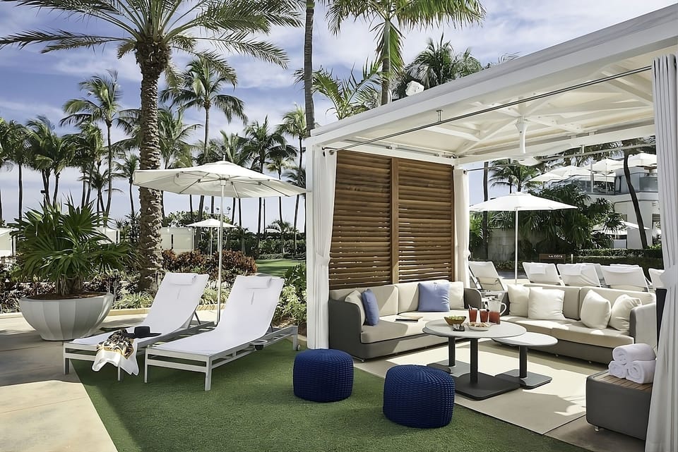 Relax poolside in a private cabana with chilled drinks.