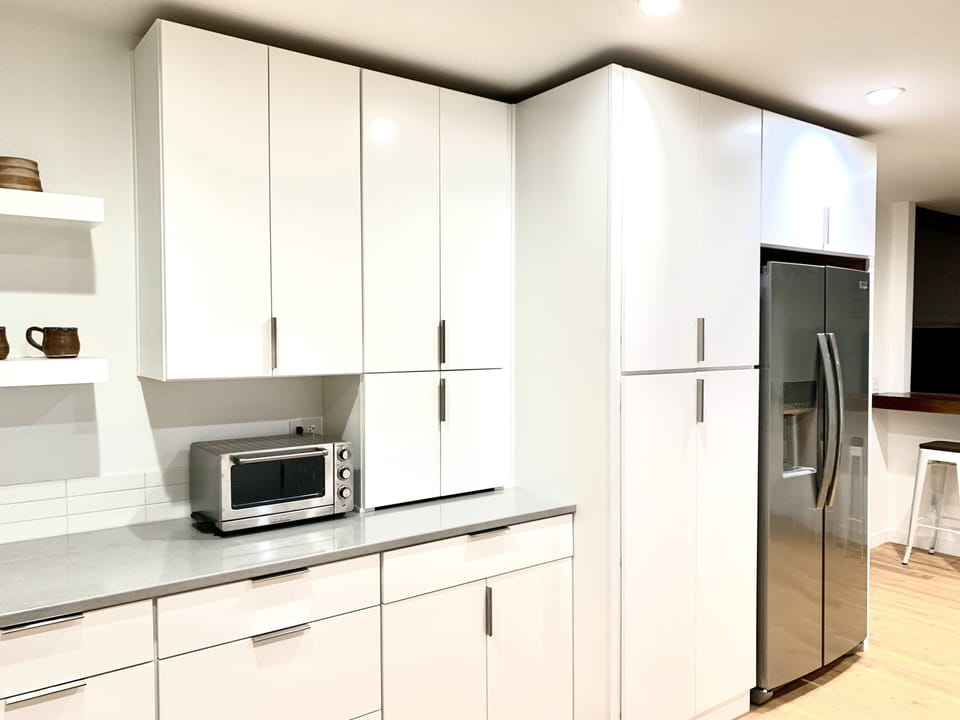 Plenty of cupboards in the spacious kitchen. 