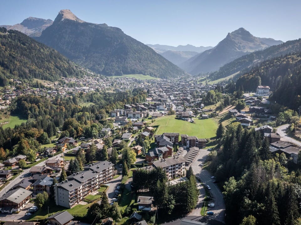 Mountain, Sky, Natural Landscape, Highland, Tree, Plant, Landscape, Mountainous Landforms, City, Mountain Range