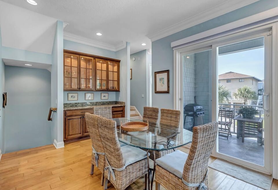 Dining Area and Lanai Access - - Dining room opens to the outdoor space with sliding glass doors and plenty of sunlight
- Gather indoors or take the fun outside to the grill and alfresco seating
- Bright and breezy space perfect for mealtime with a view