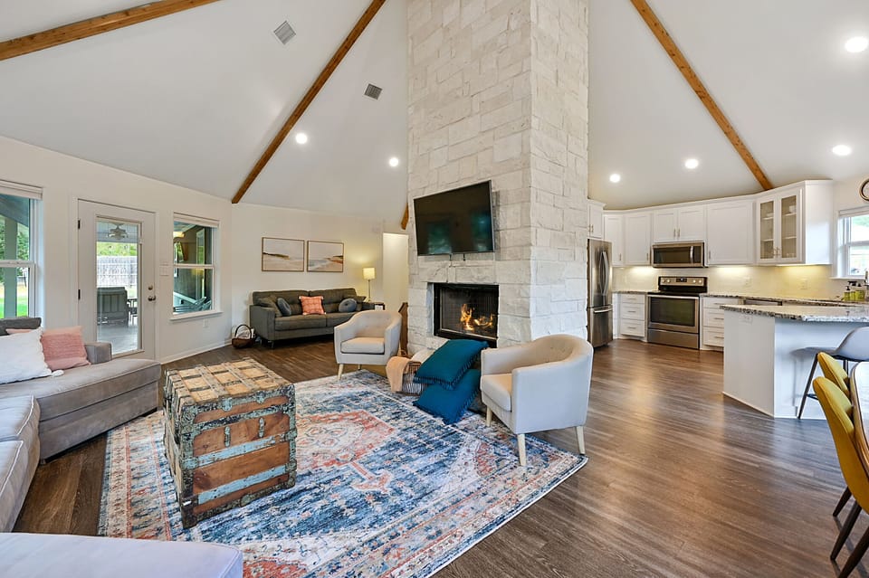 View of living room, dining area, and kitchen