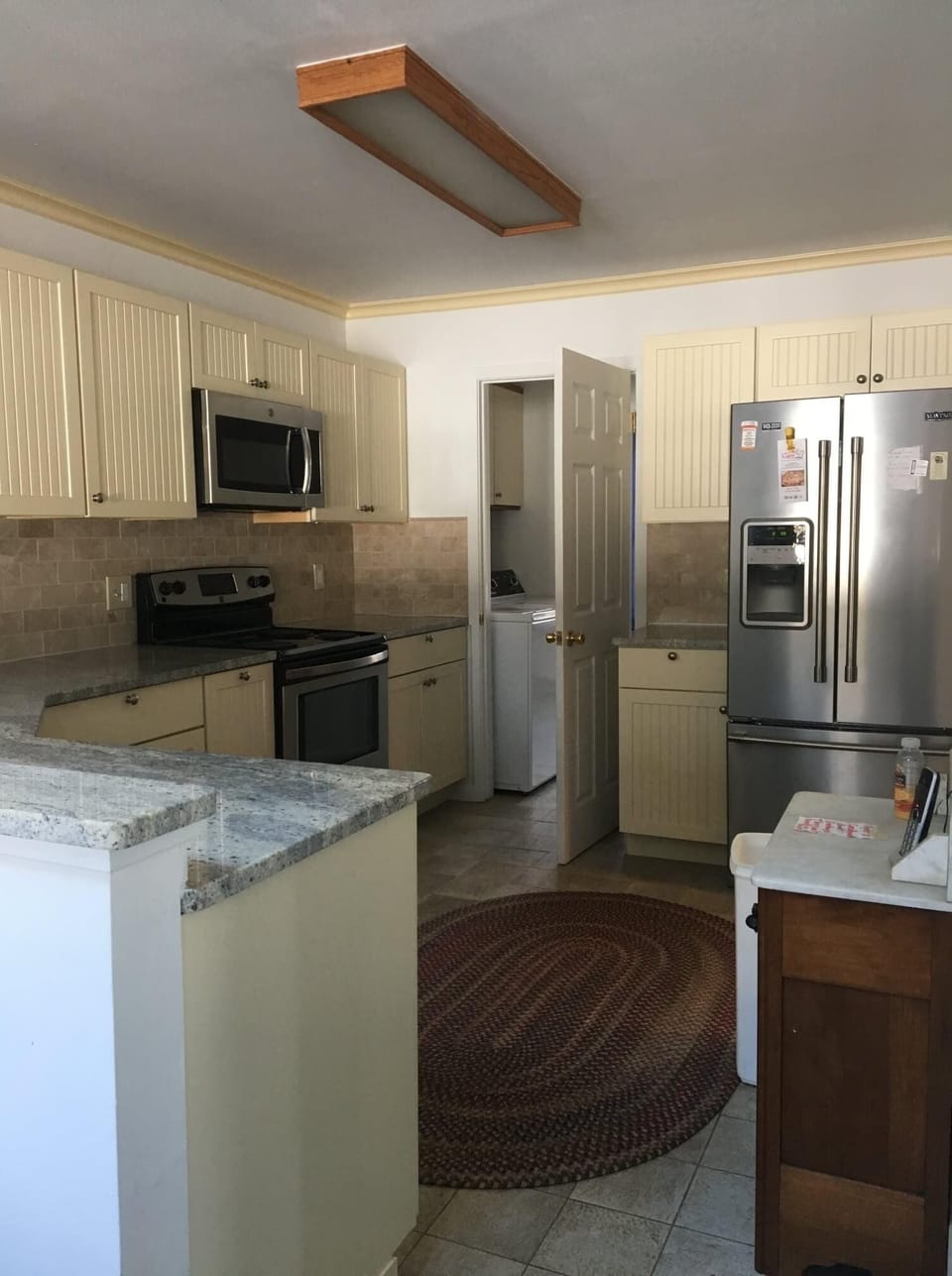 Kitchen with stainless steel appliances.