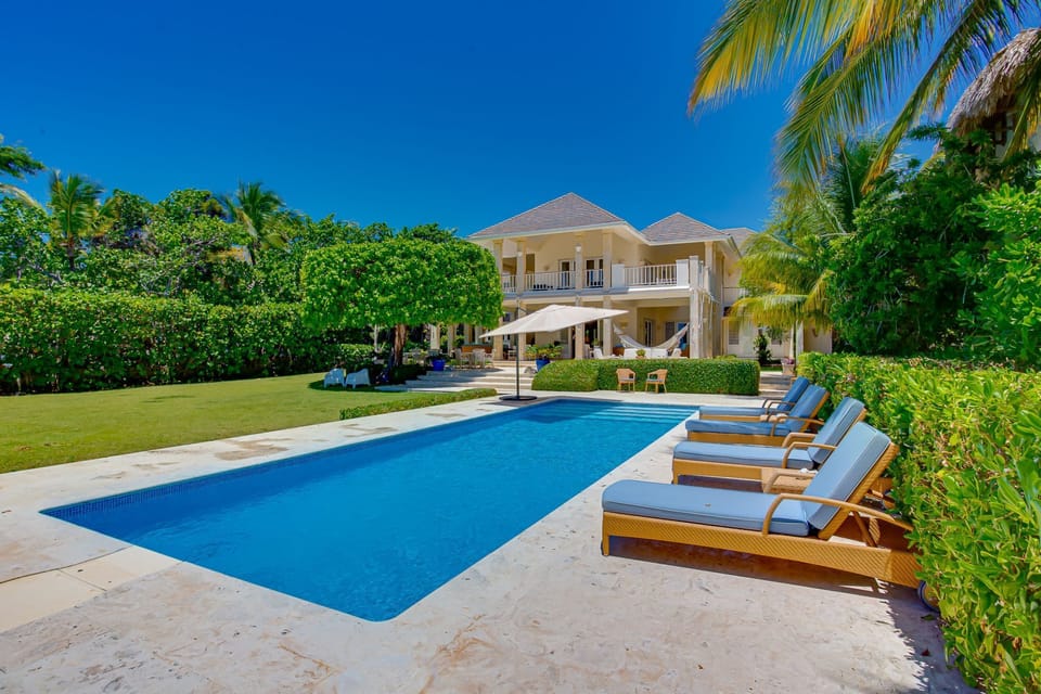 Oceanfront views with pool area, garden, and outdoor furniture