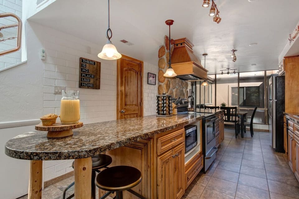 Kitchen island with 2 bar seats so you don`t miss a thing