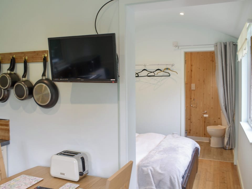 Open plan living space | Shepherds Hut 3 in Kent - The Shepherds Huts at Laddingford, Laddingford, near Maidstone
