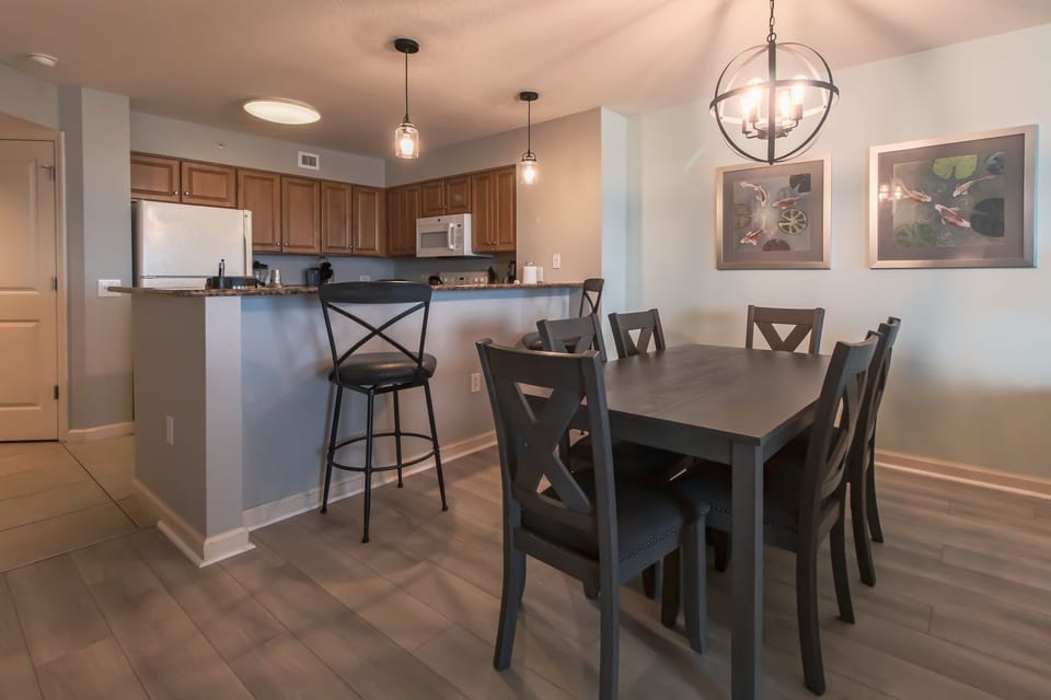 Gather around your spacious dining table for memorable meals, with a fully-equipped kitchen and breakfast bar perfect for morning coffee or evening wine.