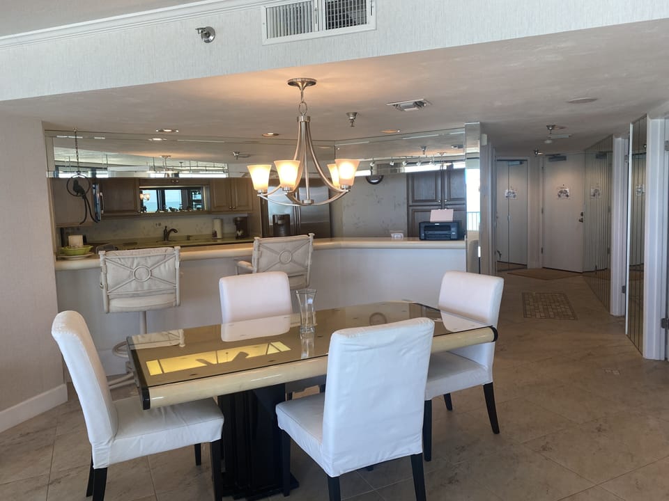 Dining area adjacent the fully equipped kitchen.