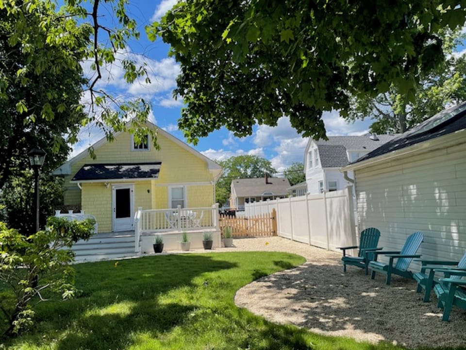 Deck, dining table & chairs,lounge seating and adirondack seating,outdoor shower
