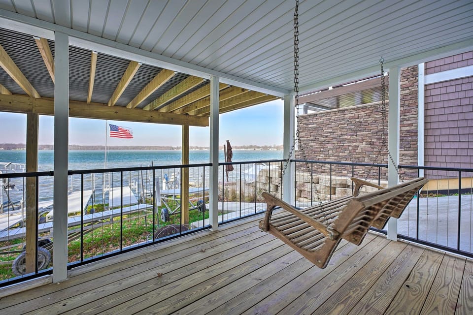 [Downstairs Covered Deck] Swinging chair available to relax in the shade.