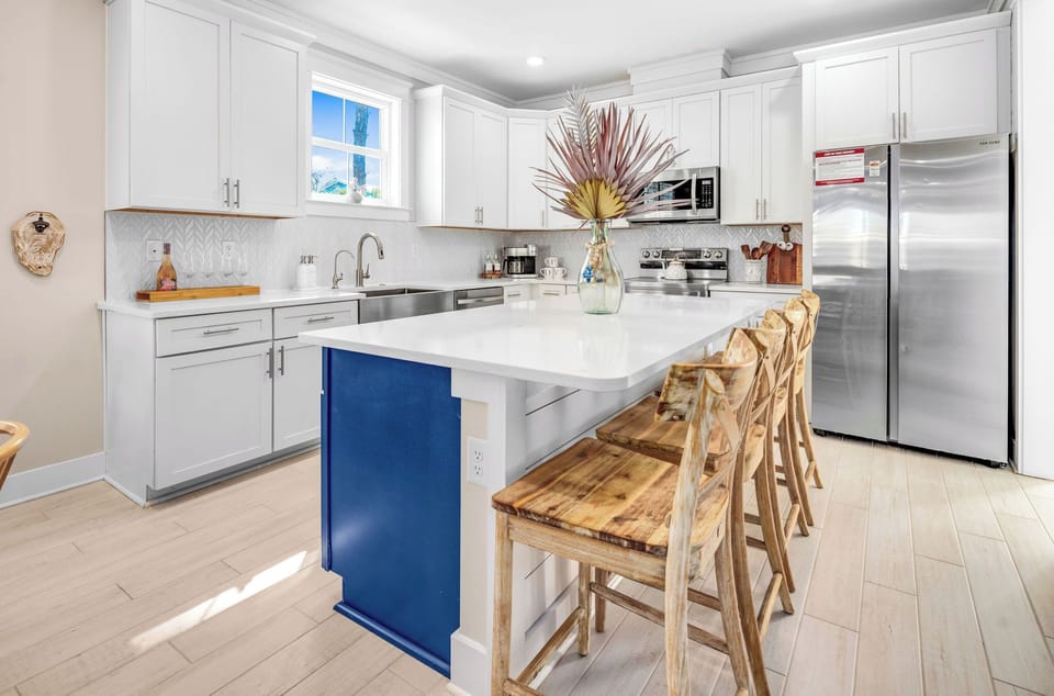The heart of the home.
A fully stocked, open-concept kitchen with island seating