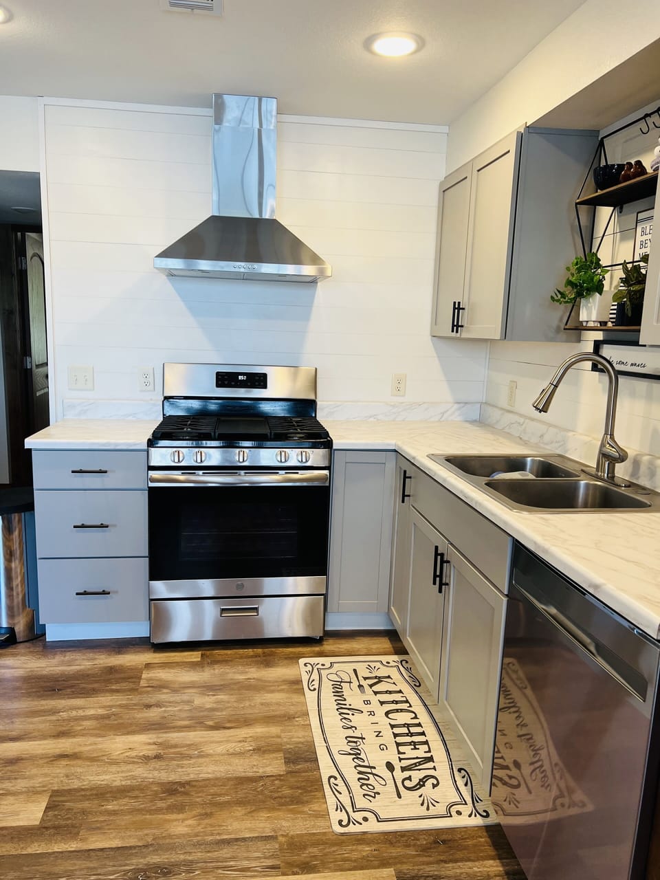 Kitchen features a 5 burner gas range. 