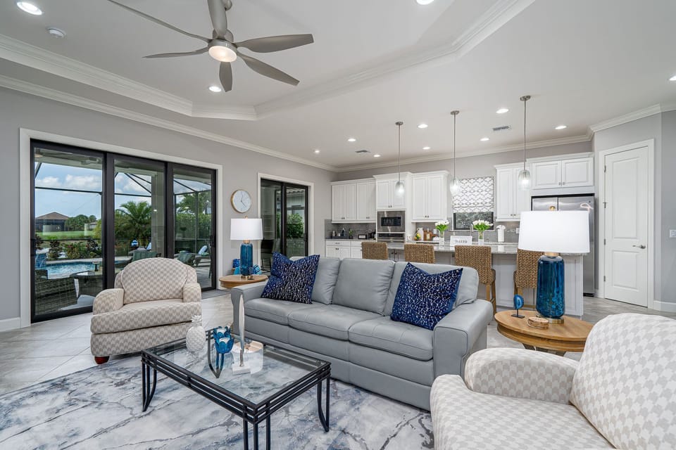 Large open concept with stunning outdoor views of pool, course and lake.
