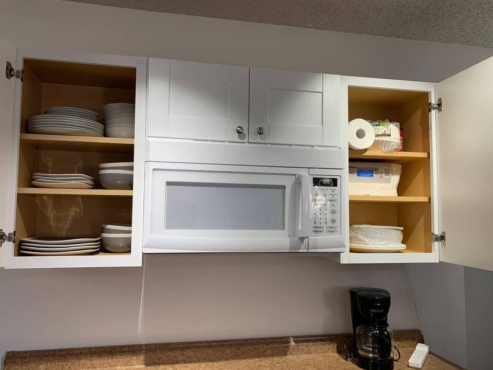 Large microwave along with plates and bowls are available