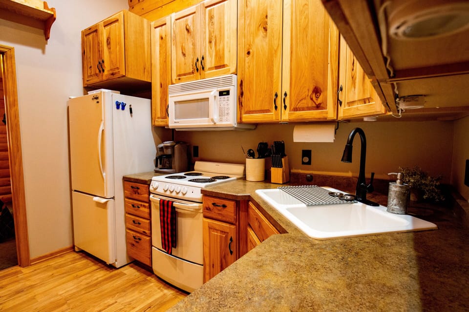 Enjoy at-home convenience in this full-size kitchen and coffee station