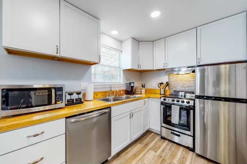 Gleaming new appliances in the kitchen include a double toaster and a K-Cup coffee machine.