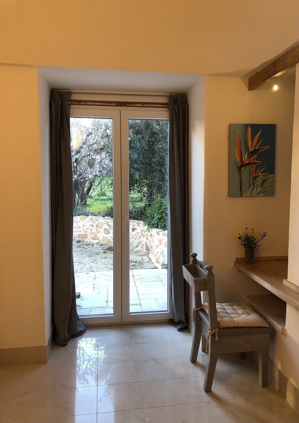 Ash Bedroom faces west, its own patio and garden. Railway nails hold the mirror.