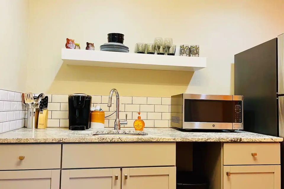 Mini-Kitchen has full-size Refrig, Keurig Coffeemaker, Hot Plate, & Microwave.