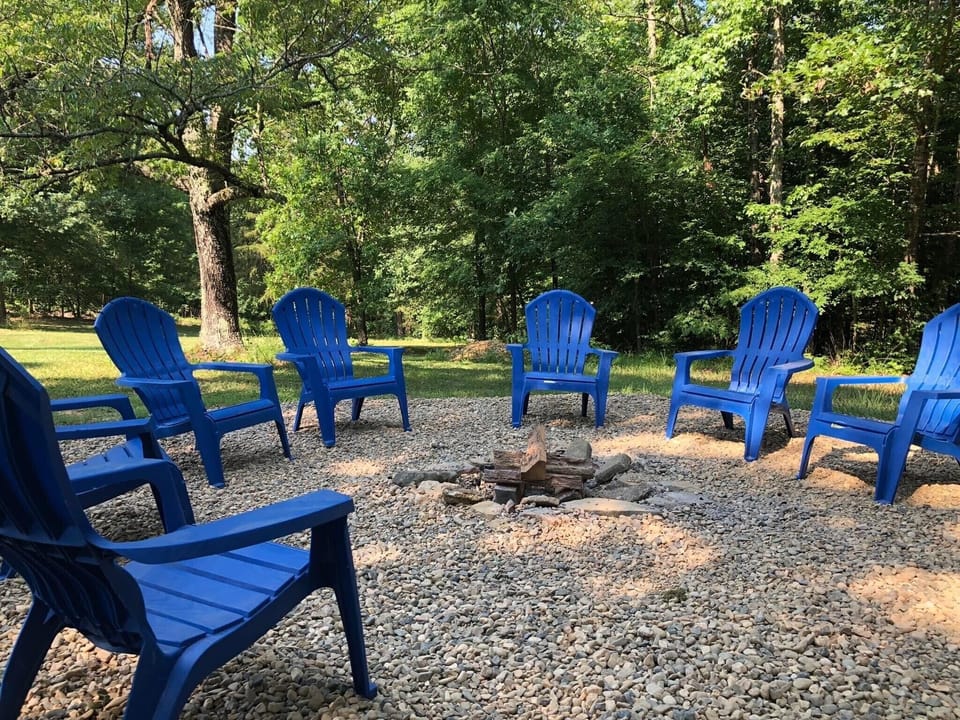 The fire pit is located on the side of the property. 