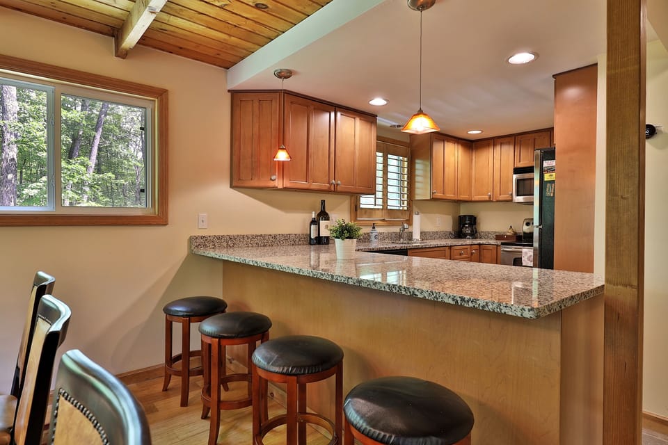 Kitchen with seating at bar top island