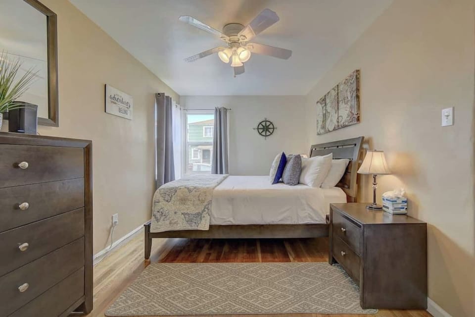 Bedroom offers plenty of light during the day plus black-out curtains for sleeping in. Plus ceiling fan and plenty of outlets to keep your devices plugged in. 