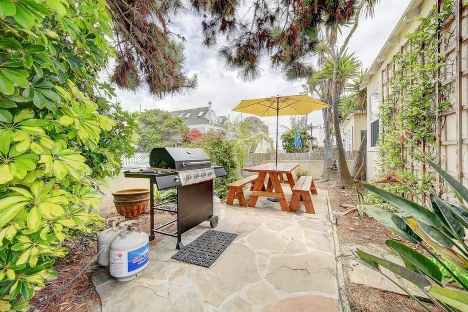 Enjoy a BBQ while sitting steps away from the beach.