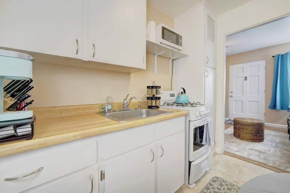 Clean and well stocked kitchen, ready for cooking. 