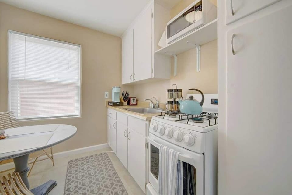 Clean and well stocked kitchen, ready for cooking. Supplied with dishes, cookware, microwave, Keurig coffee maker, toaster, spices, olive oil, and many other essentials.