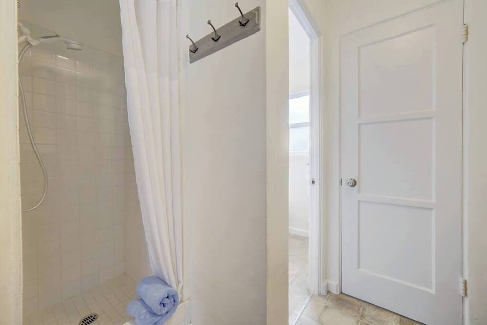 Big step-in shower with removable shower head. 