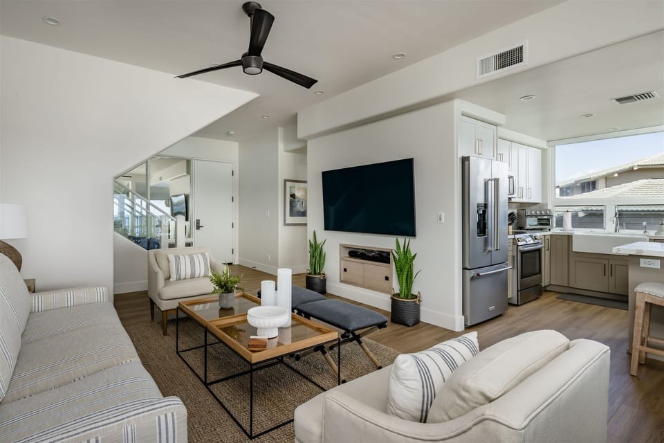 View of sitting area in the living room boasting a 70 inch flat panel tv