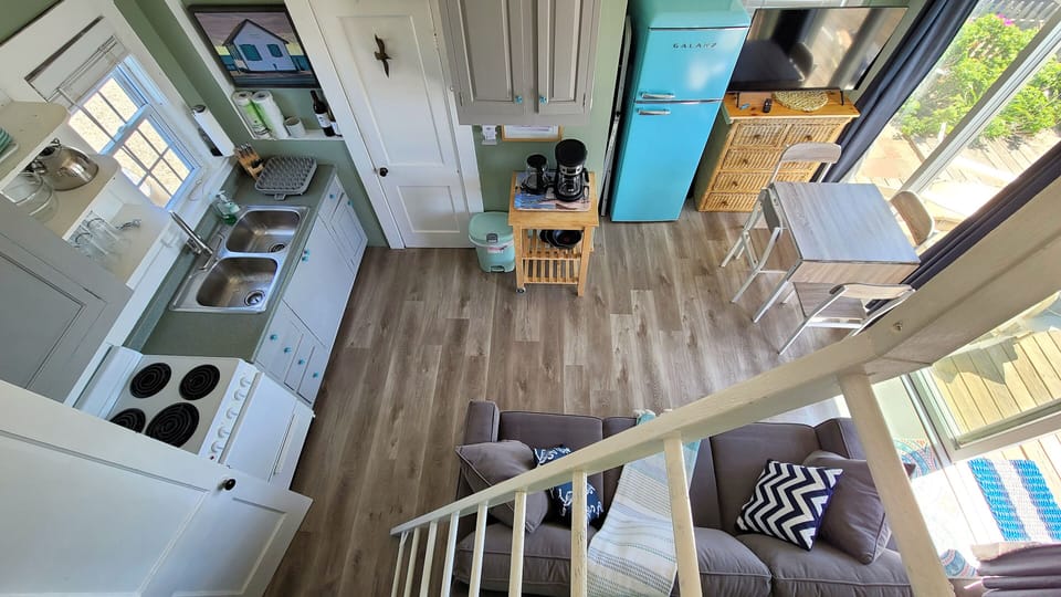 Looking down from the loft at the main living area