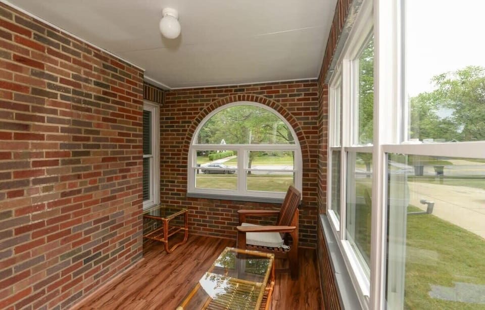 Spacious Sunroom! Relax and soak in the natural light in this airy, spacious sunroom. With plenty of room to unwind, read, or enjoy a cup of coffee, it’s the perfect spot to enjoy both the indoors and the outdoors.