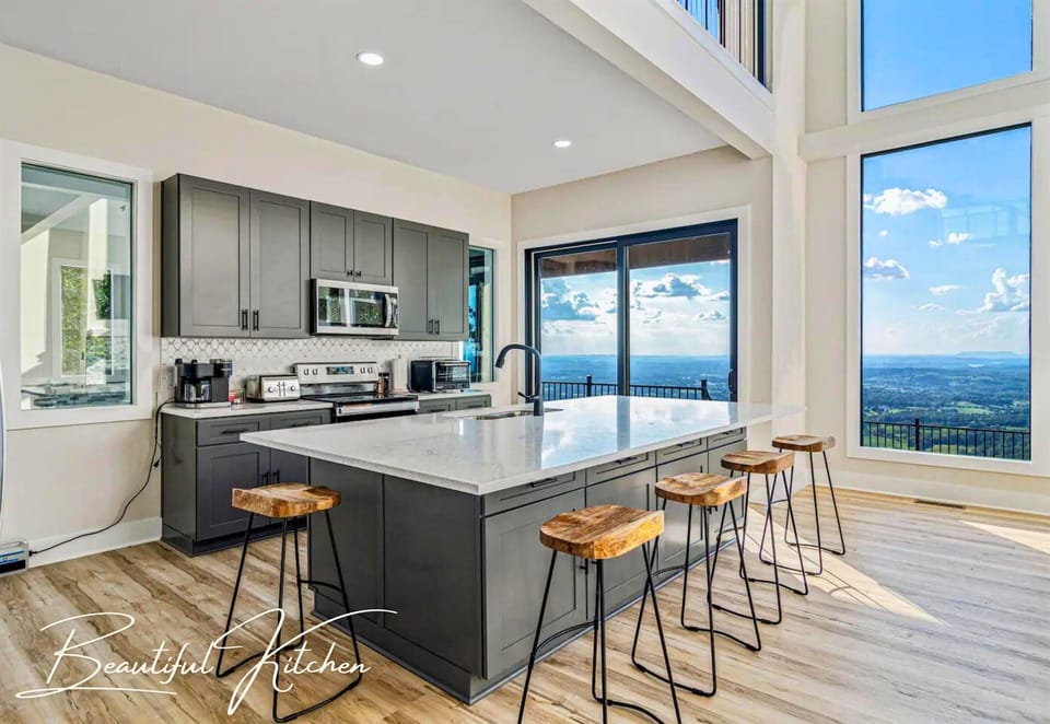 The kitchen's sleek marble countertop is both stylish and functional, perfect for preparing meals with a view.
