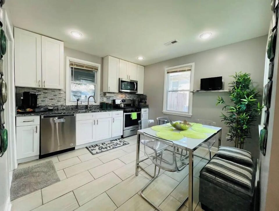 Open and spacious kitchen and dinning room area with TV.