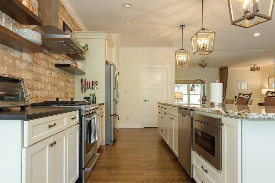 Stainless steel appliances, granite countertops and open shelving help make sure you can use the fully-furnished kitchen with ease.