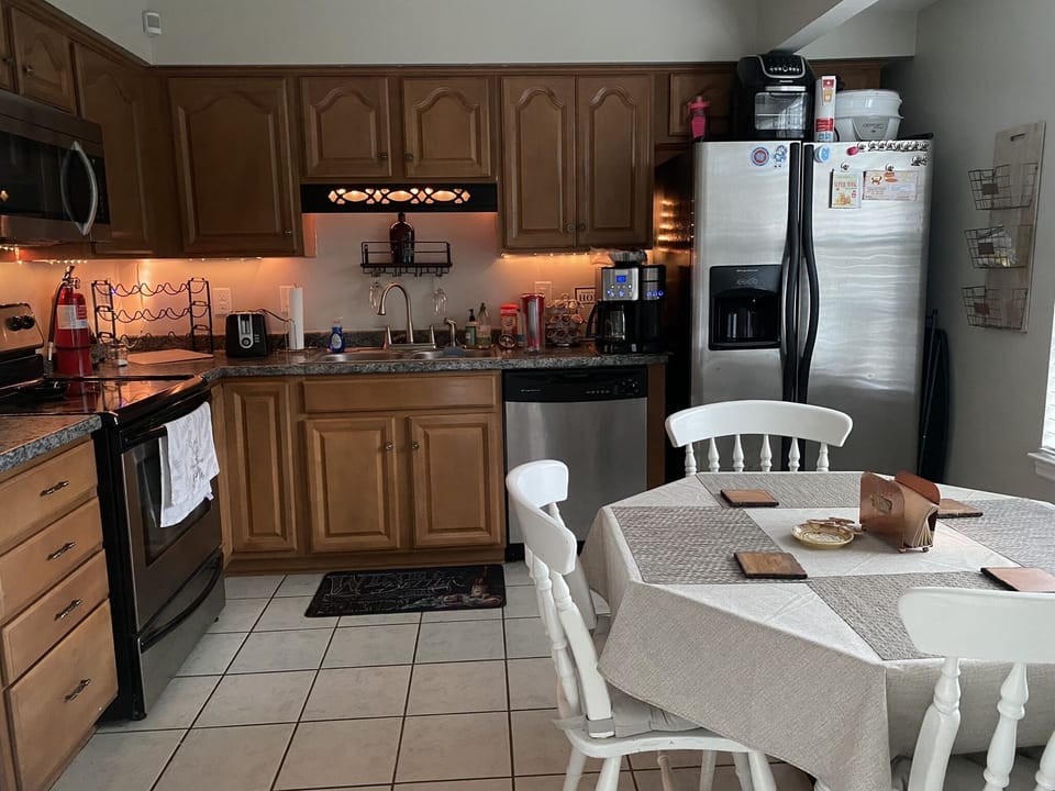 Full Kitchen with stove, oven, microwave, dishwasher & refrigerator/freezer. 