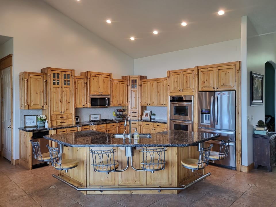 Kitchen with seating for 12.  Additional tables and chairs if needed. 