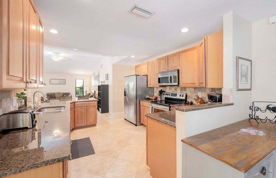 Open Kitchen with Stainless Steel Appliances
