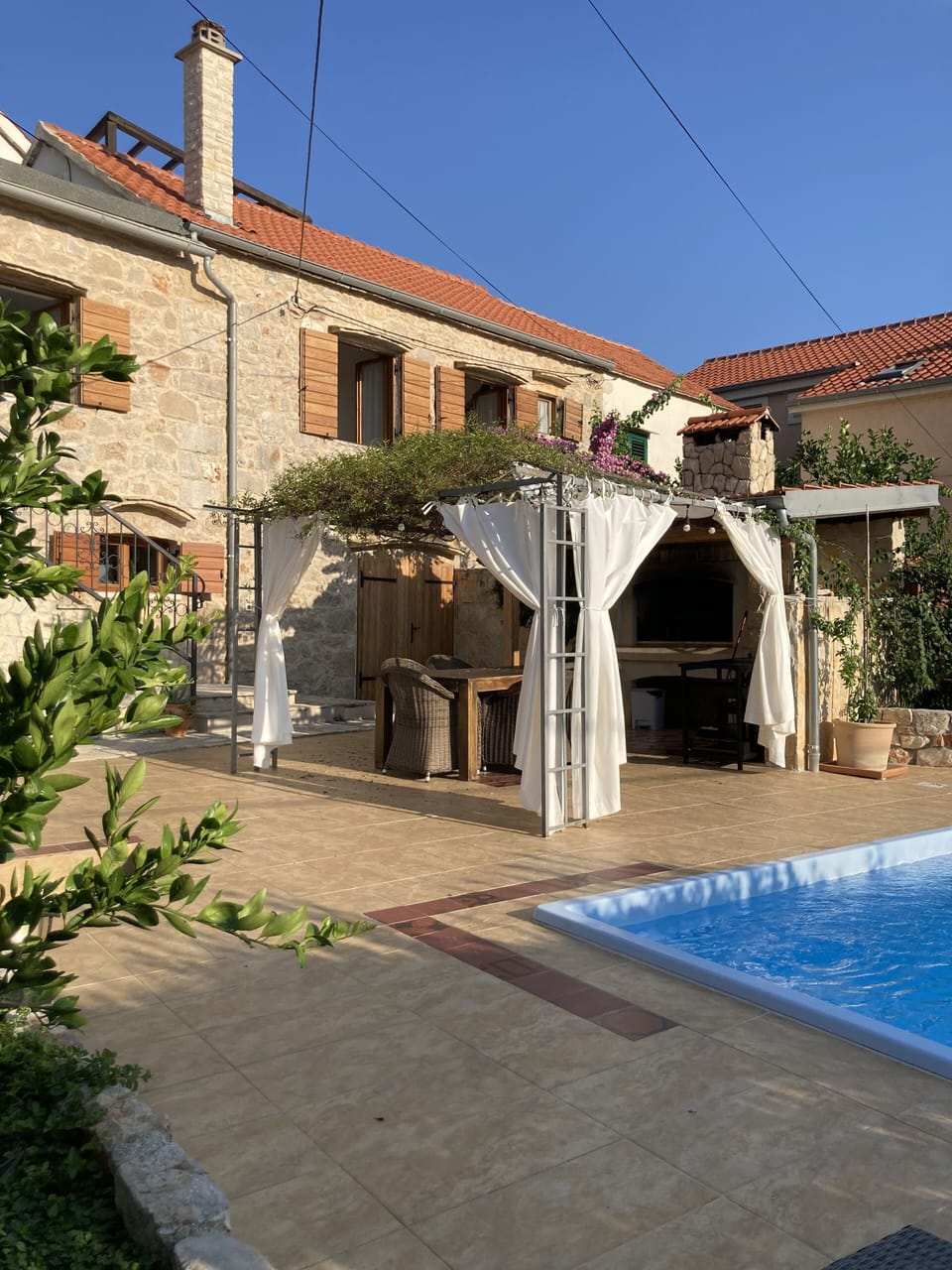 Ground floor terrace and dining area by the pool