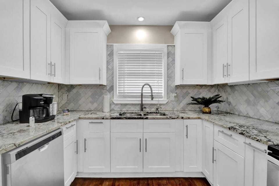 A wide, fully stocked kitchen awaits your culinary creativity. 