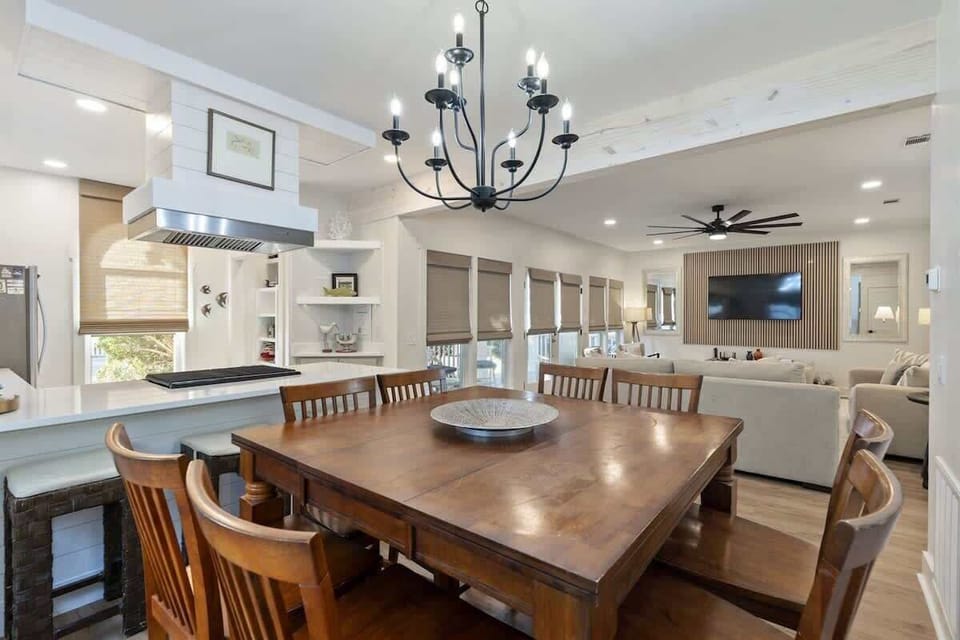 - Overlooks the bright, stylish living room, making it perfect for entertaining or conversation - Sleek white island offers extra counter space & bar seating for casual dining - Blend of coastal charm & modern touches sets a relaxed, elevated tone