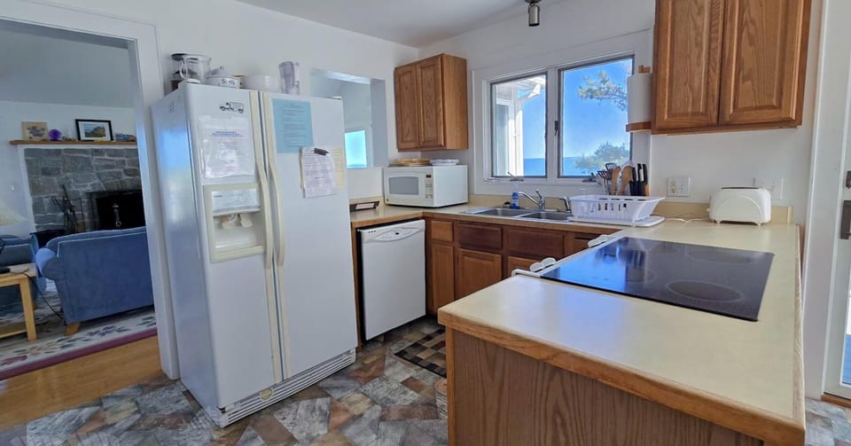 The kitchen has easy access to the deck