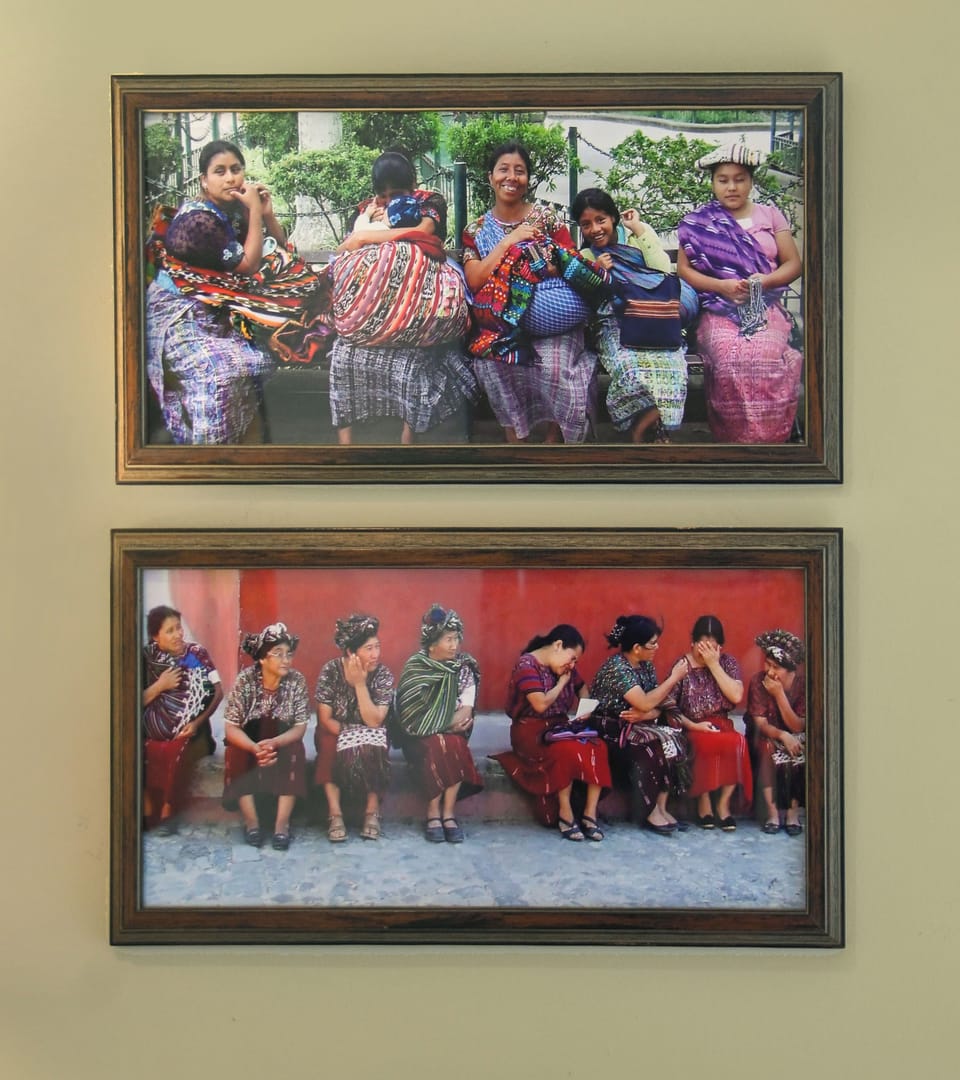 Framed photographs showcase the vibrant local culture and traditional dress of the surrounding community, adding authentic regional character to your rental space.