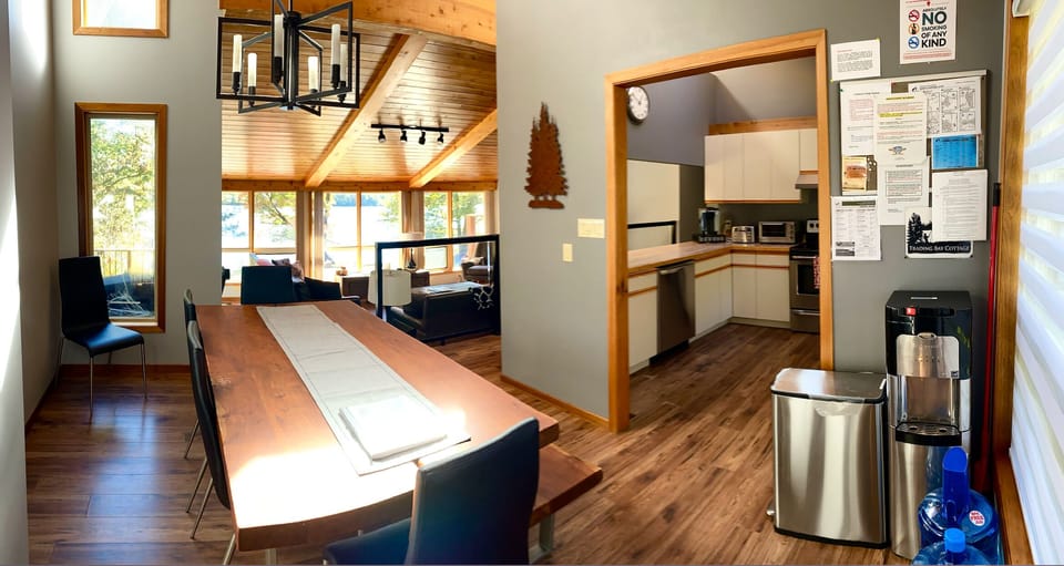 Dinning area with the kitchen at the back. Complementary water dispenser. 