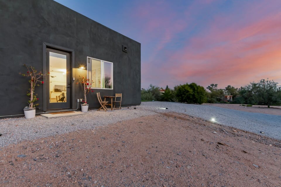 Private entrance and side yard access with ample parking and EV charging. 
