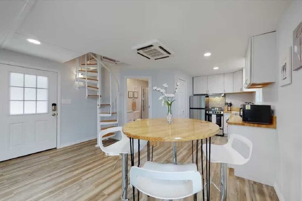 Modern bar-style seating creates an intimate breakfast nook.