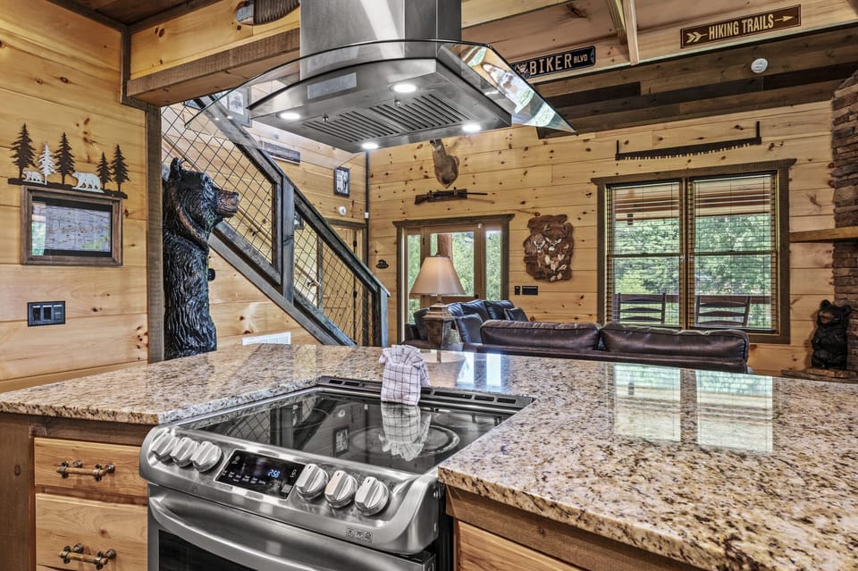 Kitchen Island & stove with three extra seating.