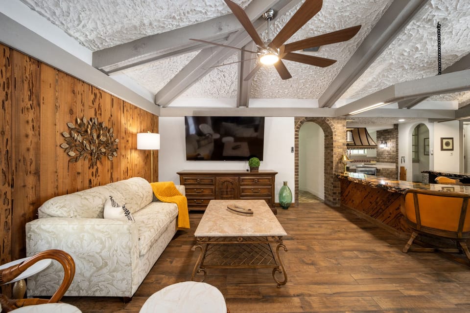 Family Room with Full Size Sleeper Sofa and 75" Smart TV