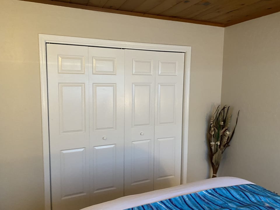 Bedroom # 1 large closet space with 2 suitcase racks.